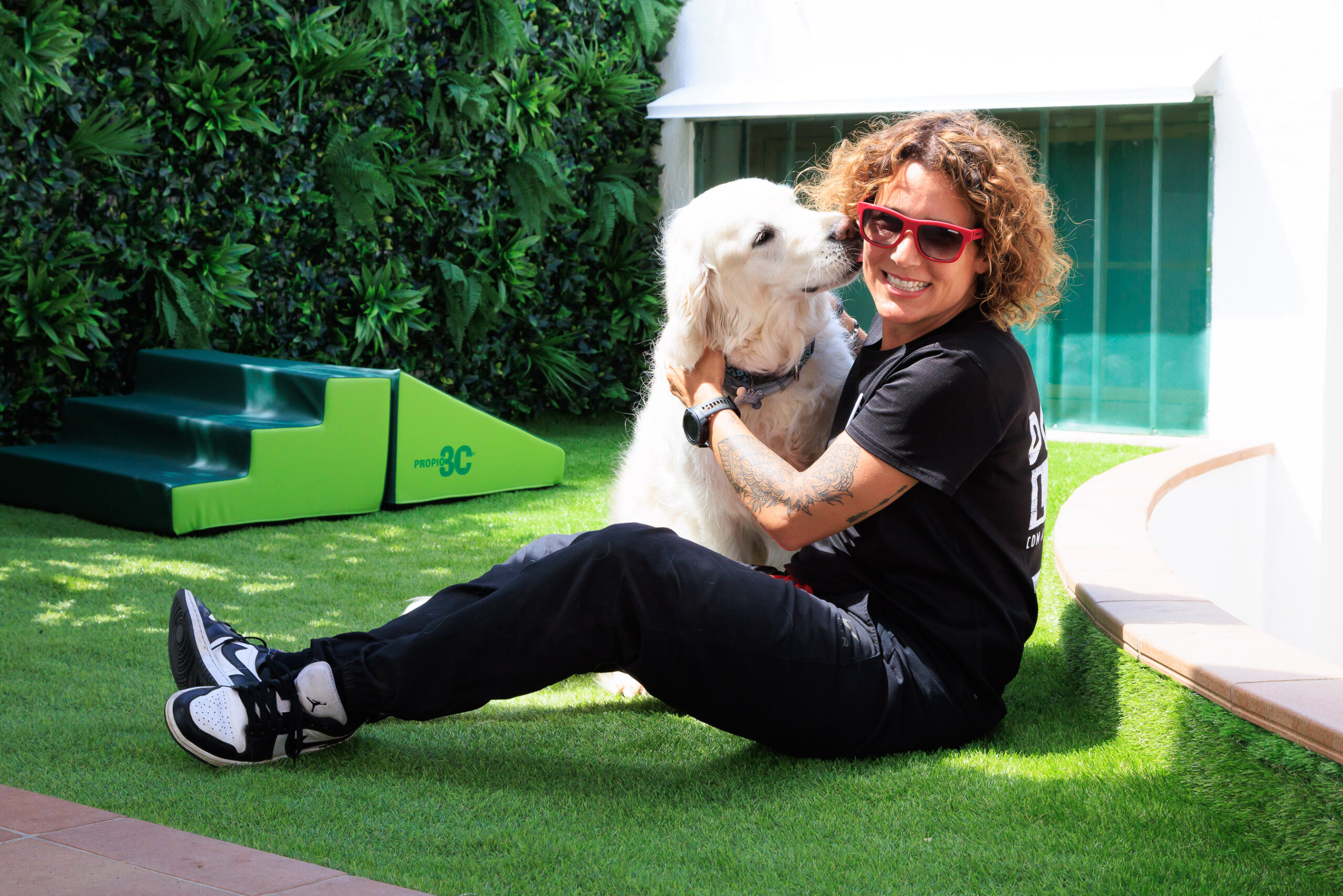 Dog licking the instructor.
